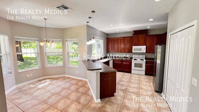 Building Photo - 12811 Moss Park Ridge Dr