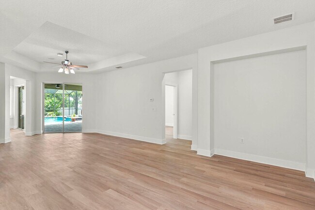 Building Photo - Expansive 4 bedroom, 3 bath remodeled home in gated community