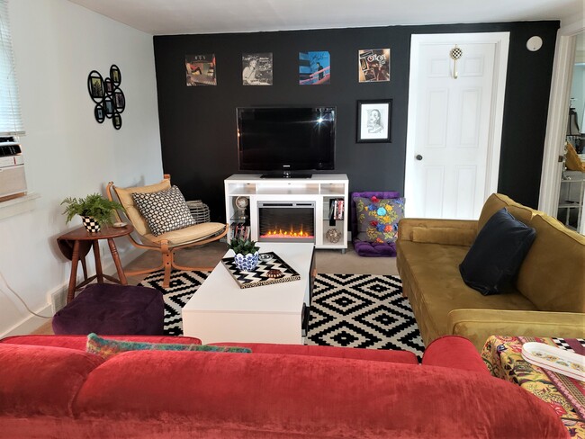 Warm and Cozy Living Room with electric fireplace that blows heat - 20 Roselawn Ave