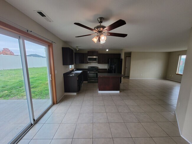 Building Photo - Comfortable 4-Bedroom Home with Fenced Bac...