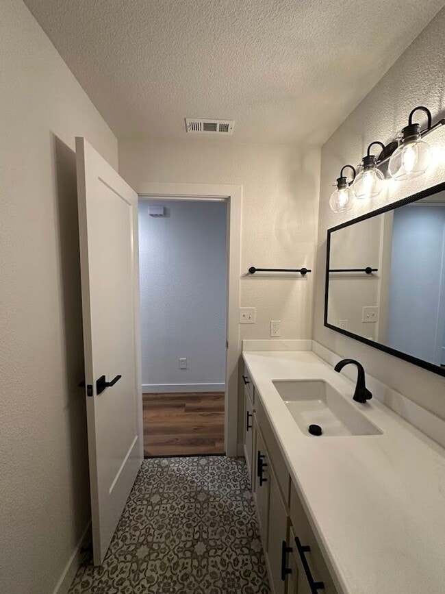 Building Photo - Updated Home with Island Kitchen, LVP Flooring, and Yard Care Included!