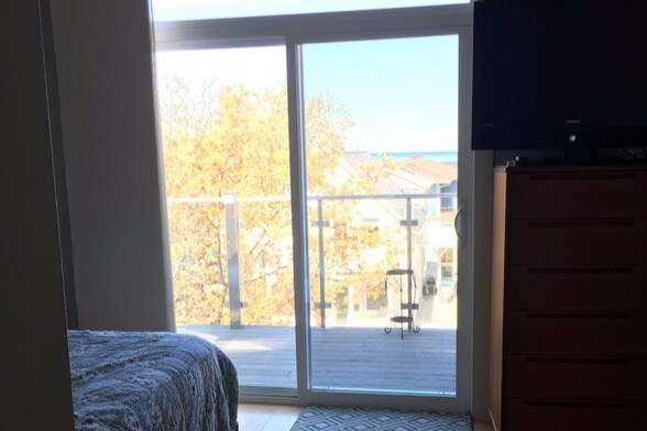 master bedroom with balcony - 2547 S Shore Dr