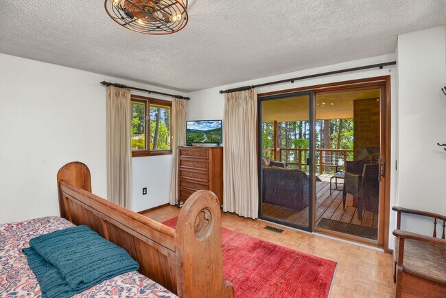 Building Photo - 2700 + sq ft family home has it all! Over 2 acres of land and a stunning view of Lake Pend Oreille