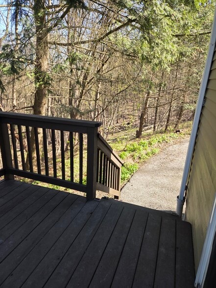 Deck steps lead to parking area - 496 Mercer Rd