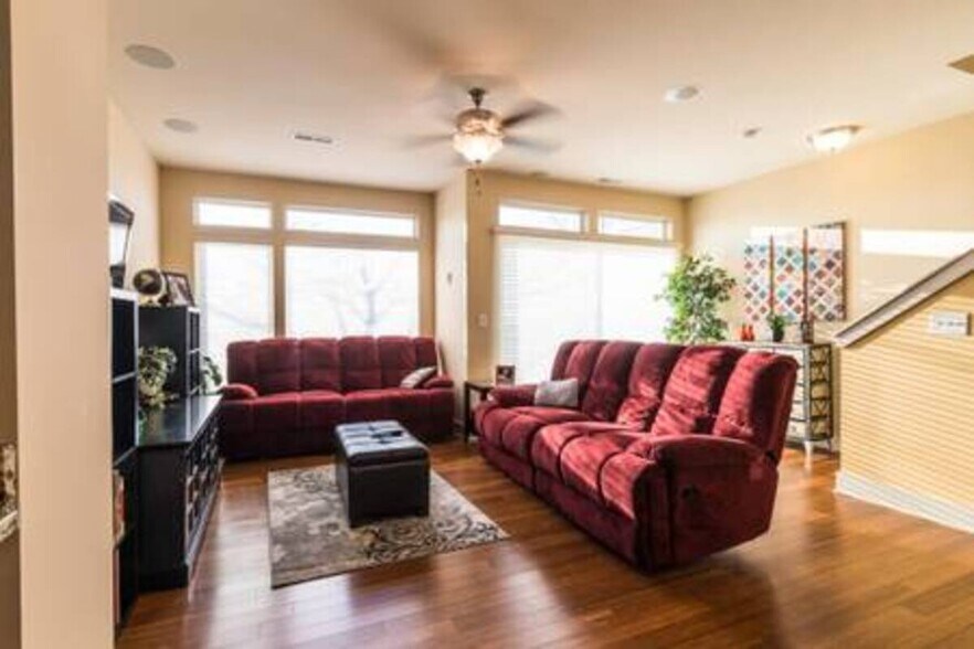 Main living area with surround sound audio and HUGE windows - 1247 W 75th St