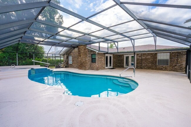 Building Photo - Executive Four-Bedroom Pool Home