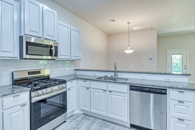 Building Photo - Brand New Construction!  Lawn care provided!