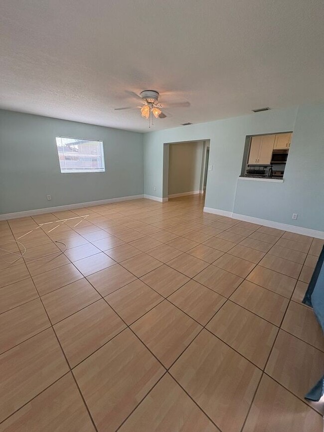 Building Photo - 3 Bedrooms on a fenced back yard and a sough after school zone Lawn Care included