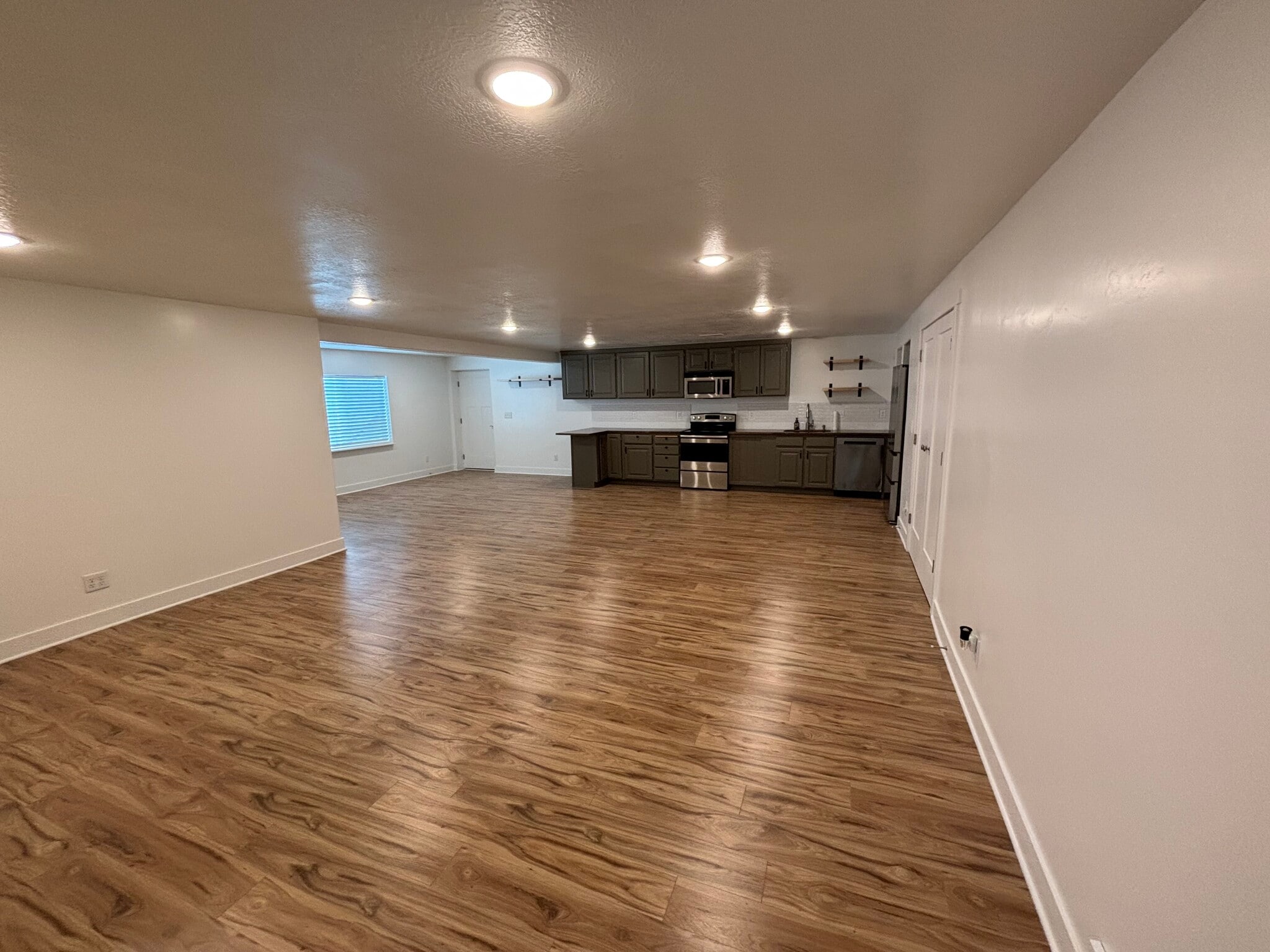 View of kitchen, dining room, and apartment entrance - 188 E Bruin Dr