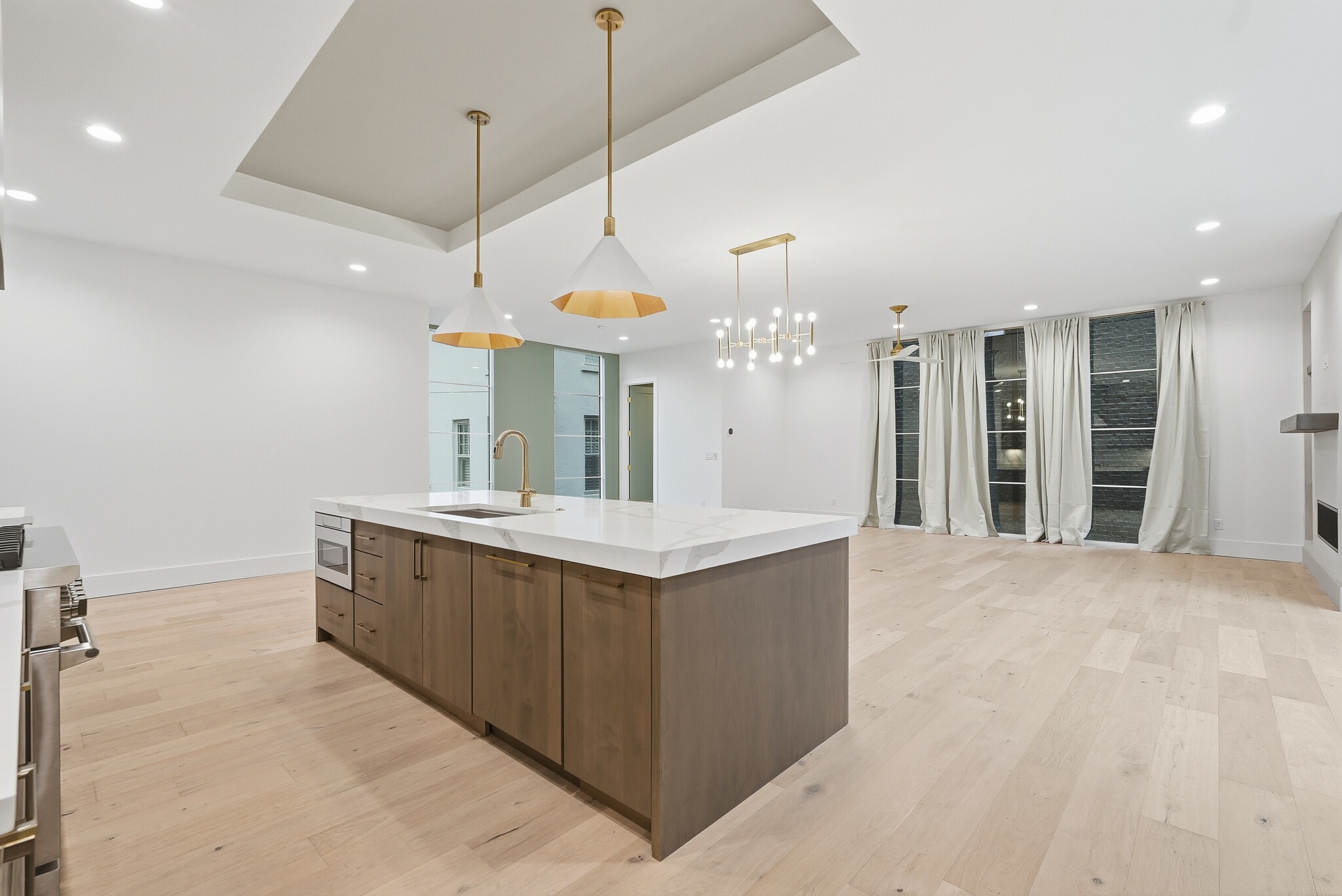 Expansive open concept living space with floor to ceiling windows and seamless flow into the kitchen - 3718 West End Ave