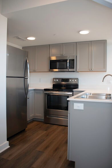 Kitchen with stainless appliances - 318 E 6th St
