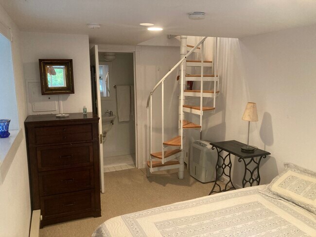 Bottom of spiral stairs - 5 River Rd