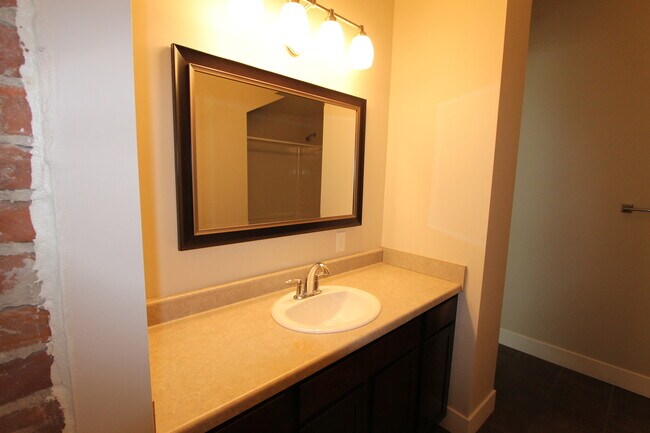 Building Photo - Midtown Renovated Duplex - Hardwood Floors, Exposed Brick