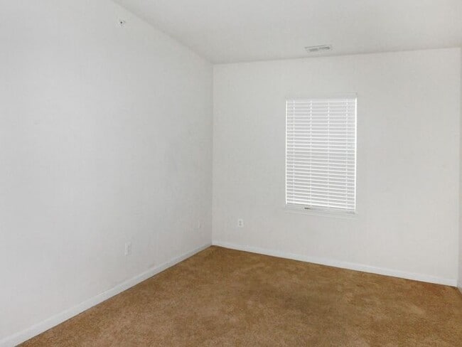 Building Photo - Pet Friendly Condo with Deck and 1 Car Garage