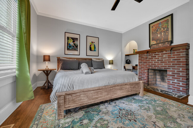 Master bedroom features a King-sized bed - 1876 DeKalb Ave NE