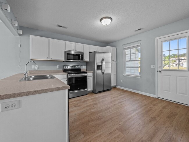 Building Photo - Welcome to Raymond's Landing!