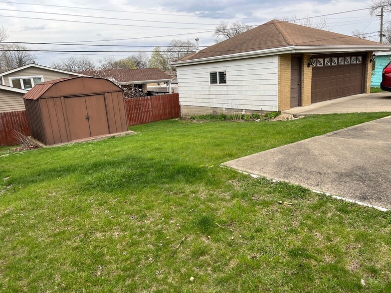 Backyard with Storage Shed - 701 N Craig Pl