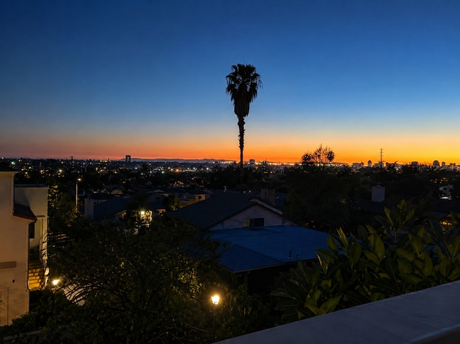 Building Photo - Beautifully Remodel Townhouse with AC & Two Car Garage!