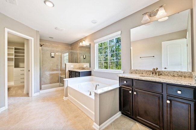 Building Photo - AVAILABLE IN MAY!  Stunning, like-new 4 bedroom, 4 bath home with large fenced yard!