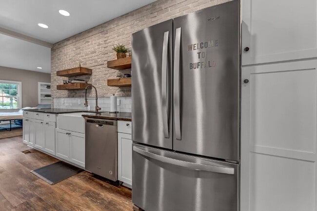 Building Photo - Furnished 1-Bedroom Lower Apartment on Main St
