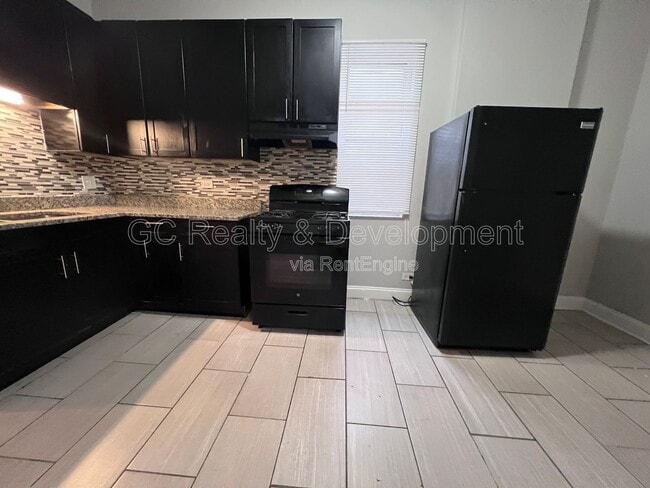 Building Photo - 7644 S Normal Ave