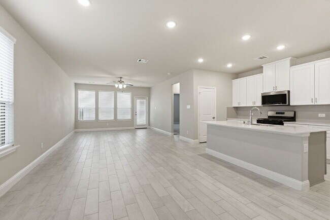 Building Photo - "Open-Concept 4-Bedroom, 2.5-Bath with Designer Finishes and Peaceful Greenbelt Views!"