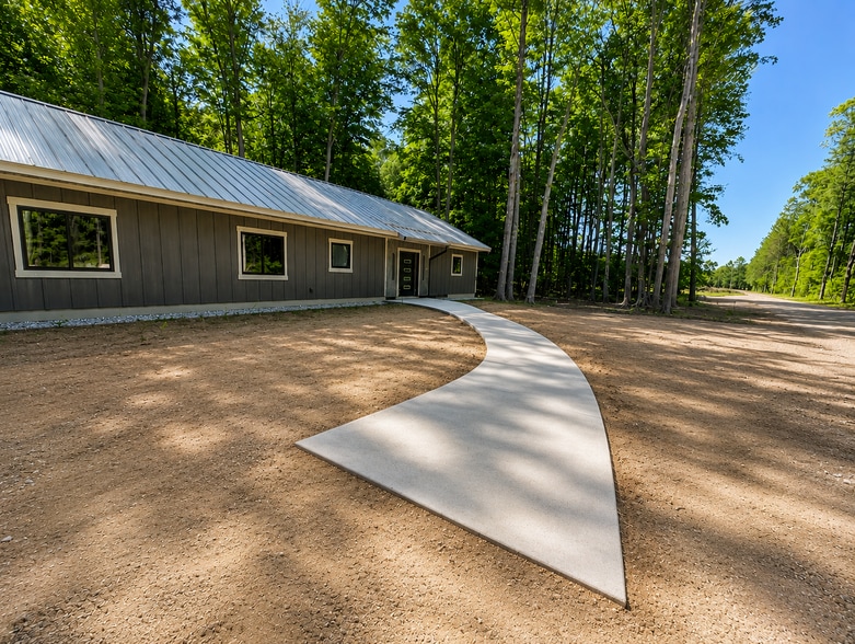 This long driveway keeps the place very private yet easy to get onto US-31 - 10671 US 31