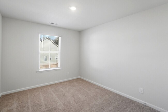 Building Photo - 4BR Home in The Pines at Paw Creek – New Construction + Private Deck