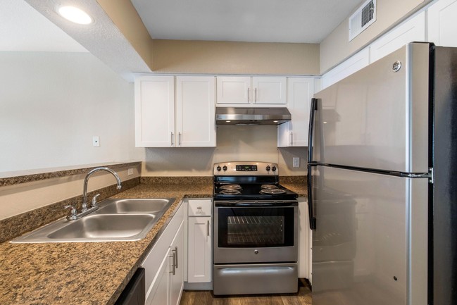 Kitchen with Stainless Steel Appliances - Lake Village West Apartments