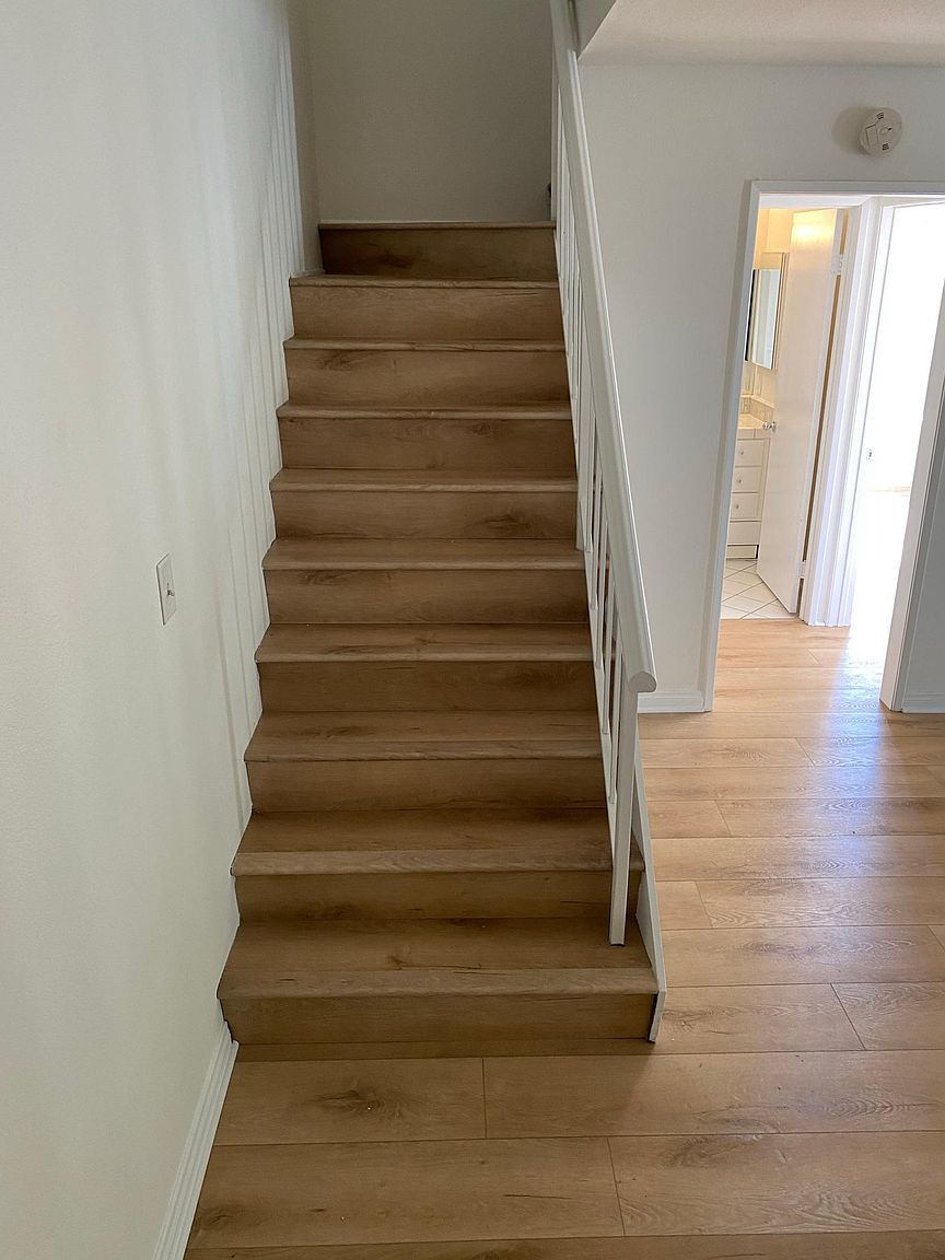 Staircase leading to the upstairs loft - 8305 Summertime Ln