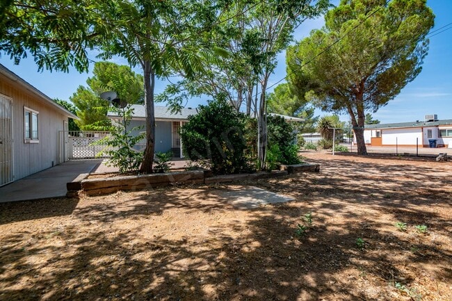 Building Photo - LARGE FENCED YARD WITH DETACHED GARAGE