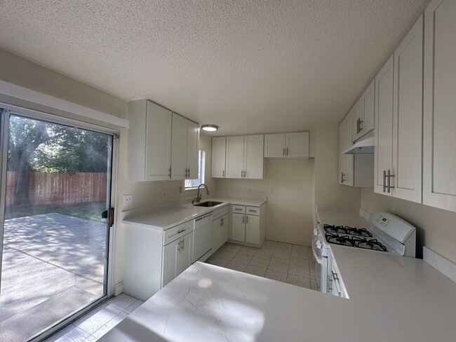 Building Photo - Recently Updated 4 Bedroom Home with Yard