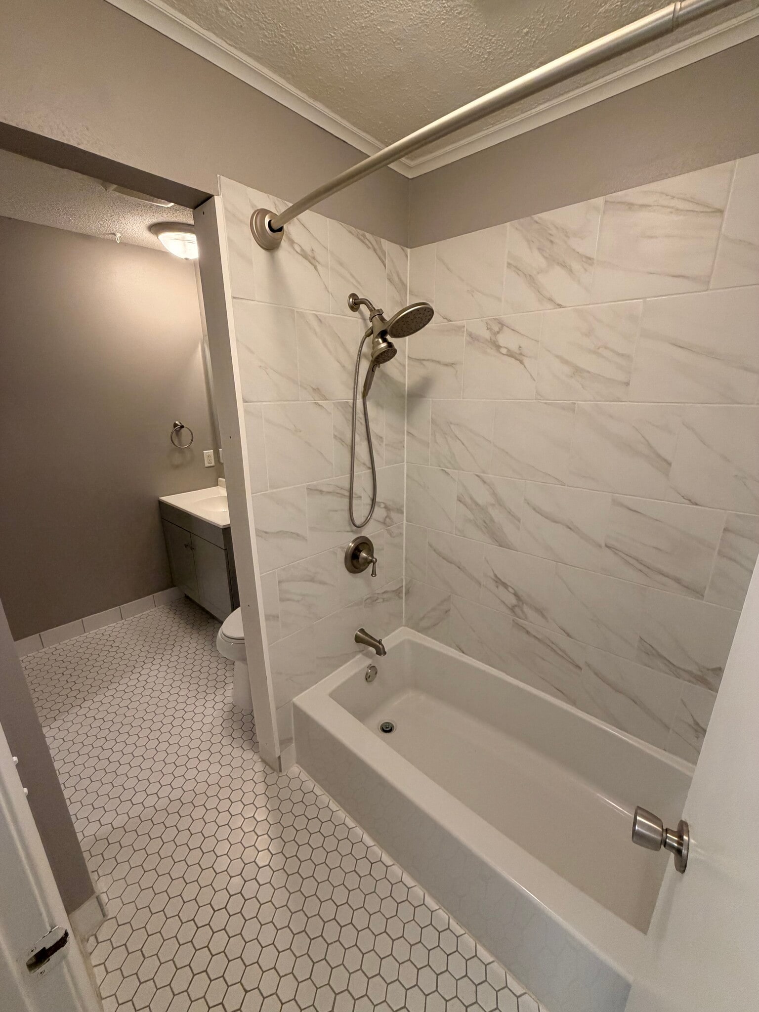 View from door of 2nd bath into Tub/Shower and into main bath. - 8935 Old Cedar Ave S