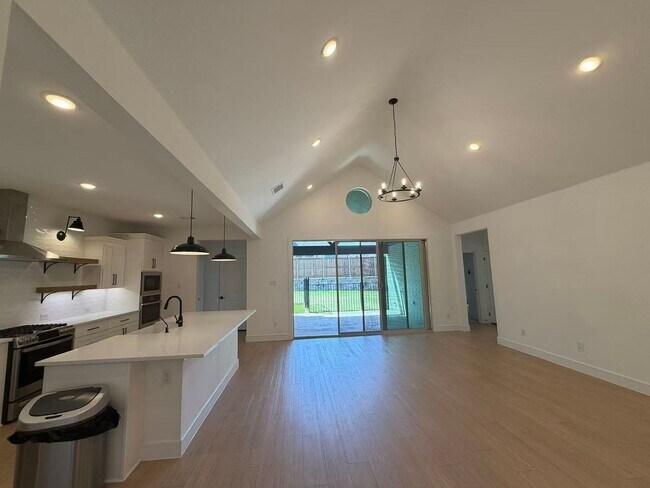 Building Photo - Move-in ready and like-new! Washer, dryer, and refrigerator Included.