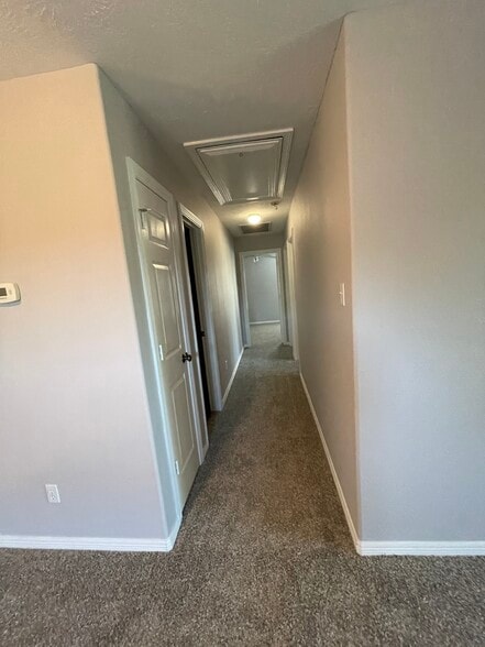 Upstairs hall - leads to 1 full bath & 3 rooms - 20100 Bitter Root Dr