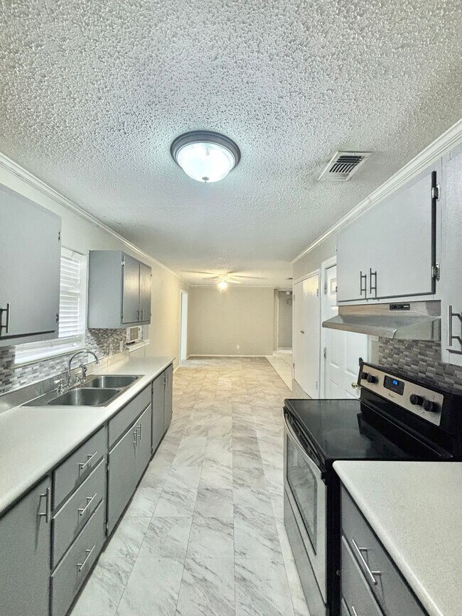 Building Photo - NOW AVAILABLE - Spacious 3-Bedroom Home + Fenced Backyard & Storage Building!