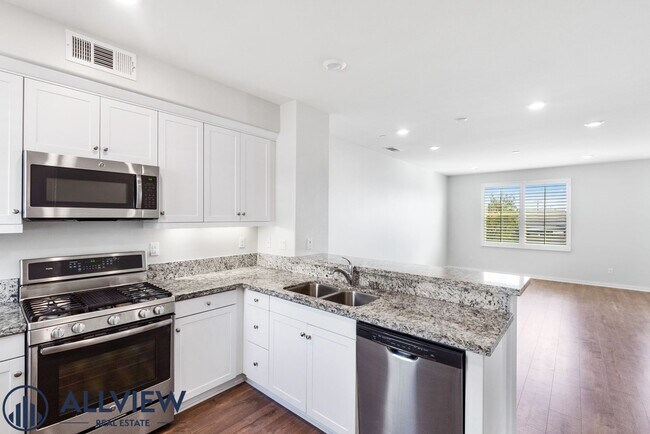 Building Photo - Modern Tri-Level Townhome with Office, 2-Car Garage & Prime Anaheim Location!