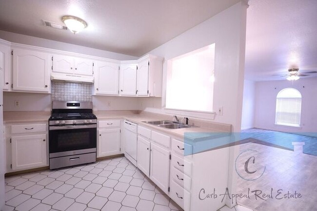 Building Photo - First month move in special $900!! Beautiful 3-bed, 2 bath condo with 2-car garage - includes was...