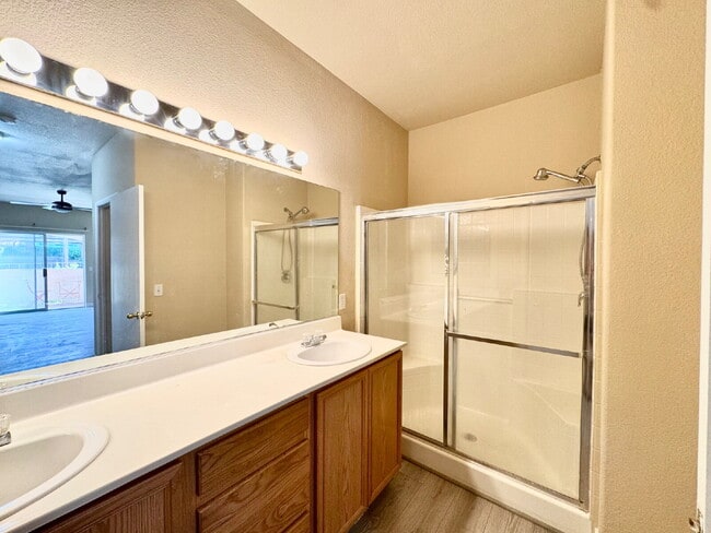 Building Photo - DOWNSTAIRS CONDO | GATED COMMUNITY | CENTENNIAL HILLS | UPDATED 3 BEDROOM
