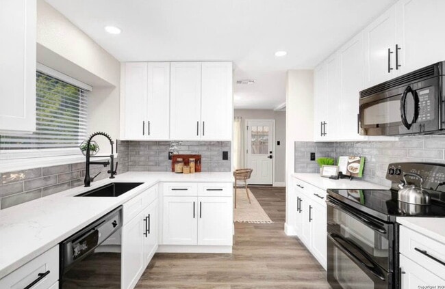 Building Photo - "Charming 4-Bedroom Home with Elegant Gran...