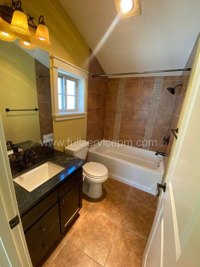 Building Photo - Spacious townhome with private backyard, garage parking, multiple decks, and a dedicated home off...