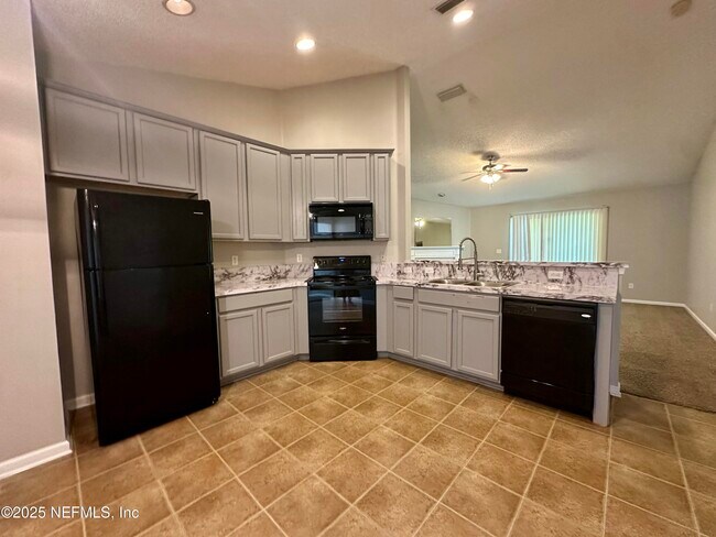 Building Photo - 6764 Gentle Oaks Dr