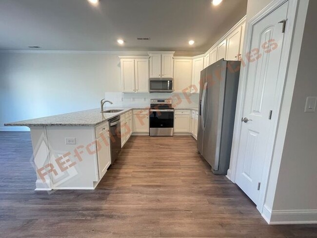 Building Photo - Brand New 3 Bedroom 1-Car Garage Townhome ...