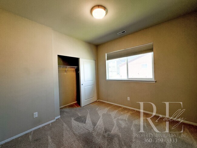Building Photo - Modern End-Unit Townhome with Private Fenced Yard, Gourmet Kitchen & Spacious Layout
