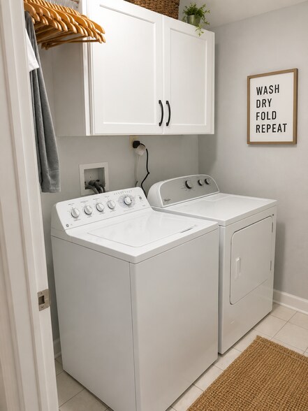 Bright and functional laundry room featuring full-size appliances and ample storage. - 3513 North Reta Avenue