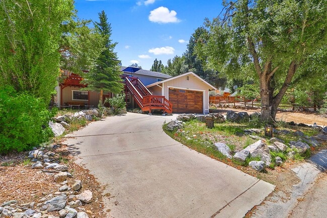 Building Photo - Charming 3 Bed Mountain Retreat | Wood Beams, Fireplace & Deck