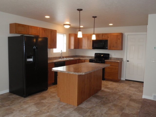 Building Photo - Newer house with attached garage. Half mon...