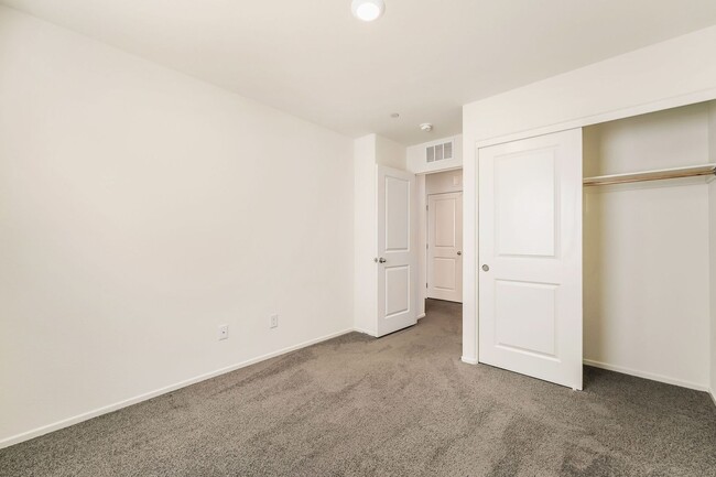 Building Photo - Modern West Henderson Townhome with Sleek Upgrades & Smart Home Features!