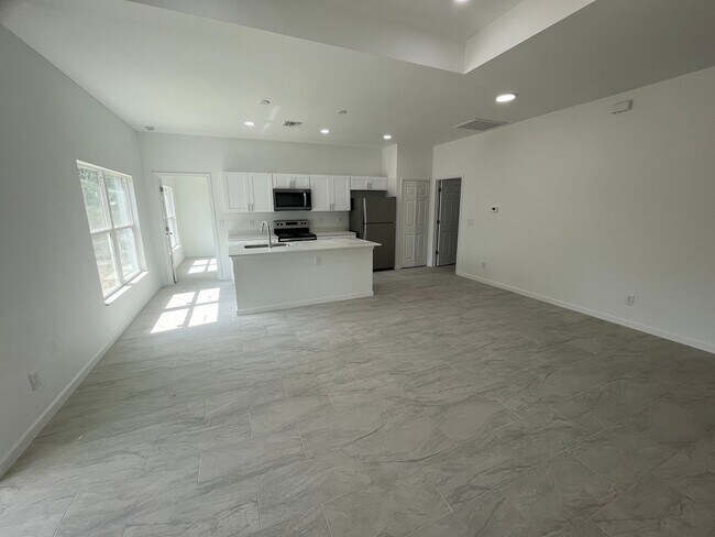 Building Photo - MODERN BRAND NEW RETREAT IN LEHIGH ACRES!