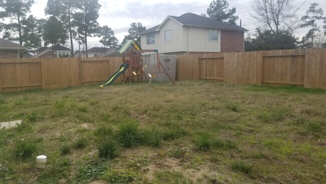 large back yard with storage shed and playset - 16778 N Bob White Dr